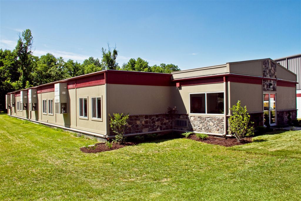 Modular sales office building in Pedricktown, NJ, surrounded by a spacious grassy yard